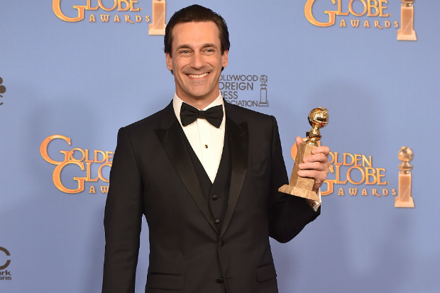 Jon Hamm all smiles after winning his second Globe for Best Actor in a Drama Series.